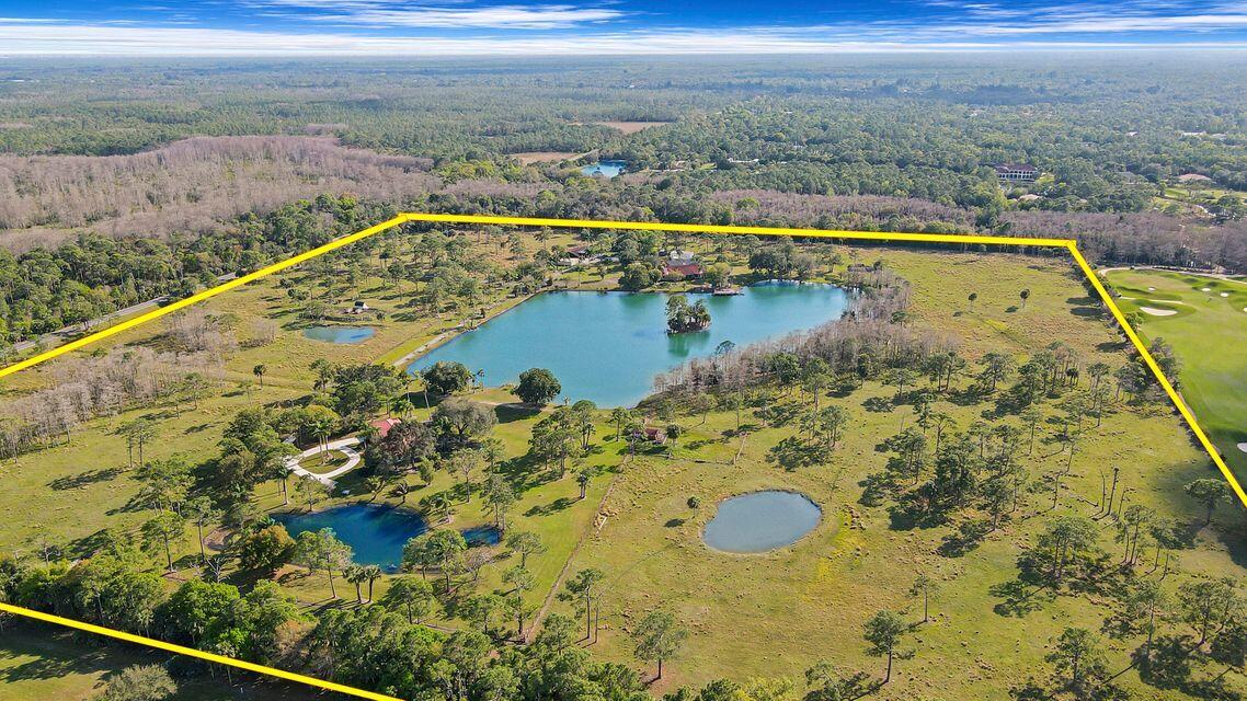 19900 Mack Dairy Road Jupiter, FL 33478 - Photo 2 of 11 a view of a swimming pool and an ocean