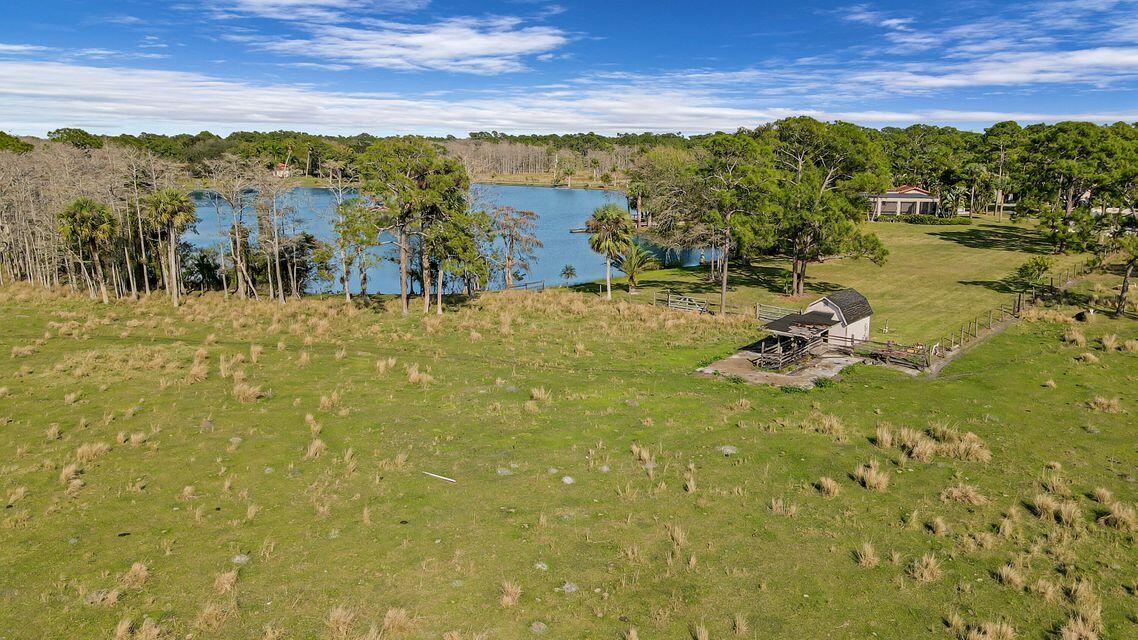19900 Mack Dairy Road Jupiter, FL 33478 - Photo 3 of 11 a view of a lake with houses