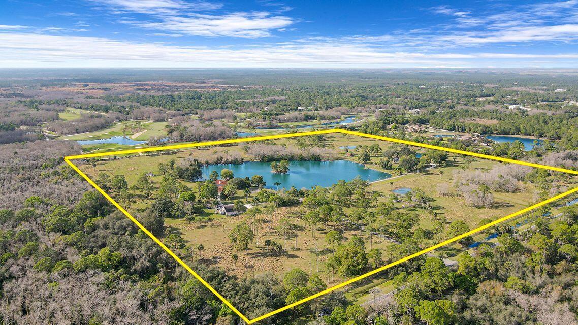 19900 Mack Dairy Road Jupiter, FL 33478 - Photo 10 of 11 a view of a swimming pool with a terrace