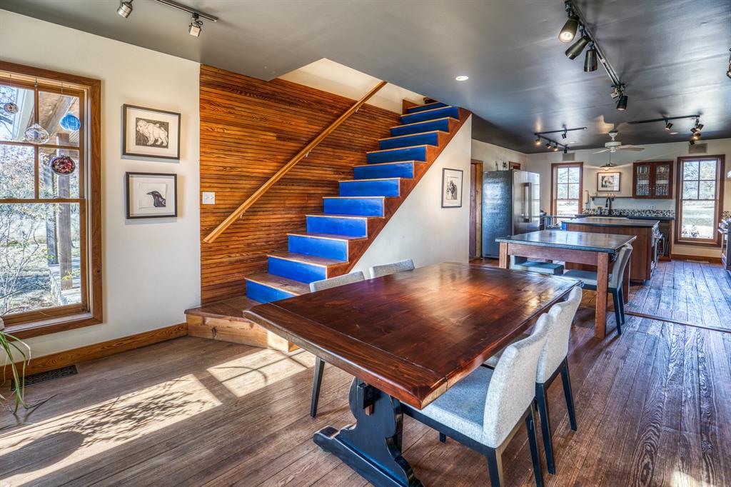 2969 County Lane Talpa, TX 76882 - Photo 13 of 40 a room with stairs and wooden floor