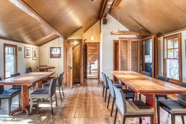 a dining room with furniture and window