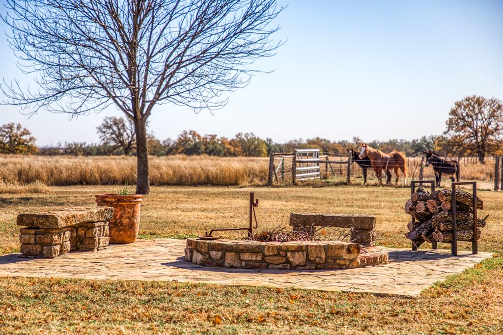 2969 County Lane Talpa, TX 76882 - Photo 31 of 40 a view of a water fountain in front of house