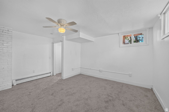 220 East Greenwood Avenue Midvale, UT 84047 - Photo 34 of 46 Spacious room featuring neutral carpeting and white walls