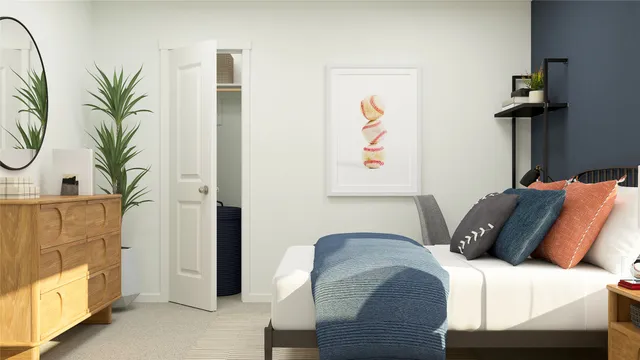 a bedroom with furniture and a potted plant