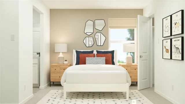 a bedroom with a bed and painting on the wall
