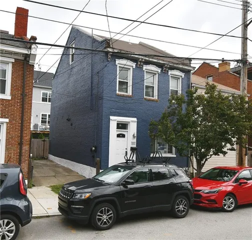 a car parked in front of a house
