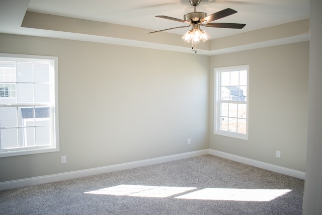 112 Cherry Fields Clarksville, TN 37042 - Photo 11 of 19 an empty room with windows and fan