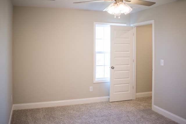 112 Cherry Fields Clarksville, TN 37042 - Photo 15 of 19 an empty room with chandelier fan