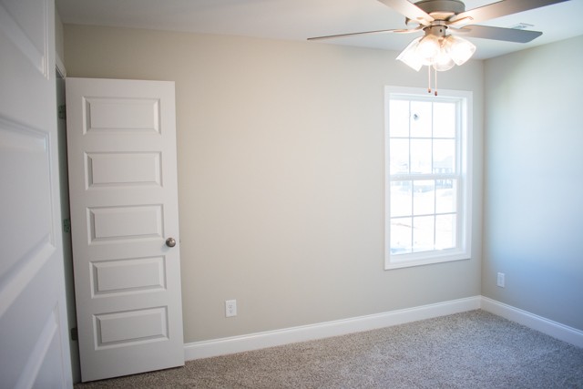 112 Cherry Fields Clarksville, TN 37042 - Photo 16 of 19 an empty room with windows and fan