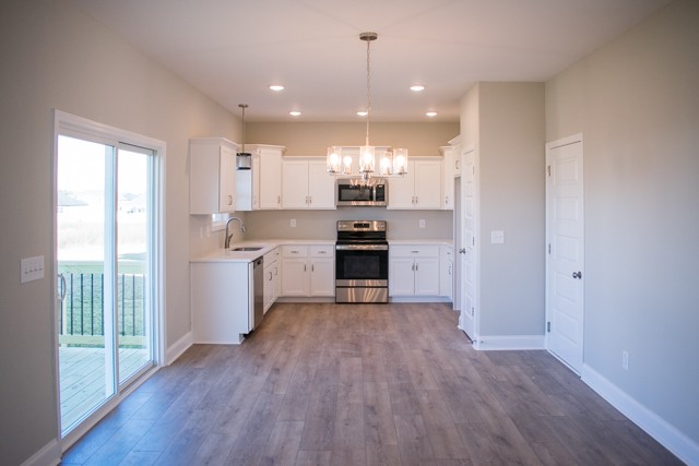 112 Cherry Fields Clarksville, TN 37042 - Photo 2 of 19 a view of kitchen with granite countertop stainless steel appliances cabinets and a wooden floor