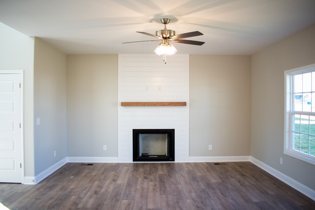 112 Cherry Fields Clarksville, TN 37042 - Photo 7 of 19 an empty room with windows and a fireplace