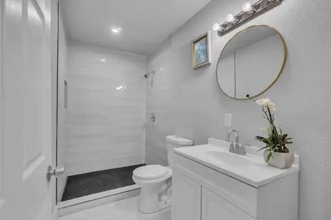 110 North Hillside Street Red Oak, TX 75154 - Photo 16 of 25 Bathroom with vanity and a shower stall