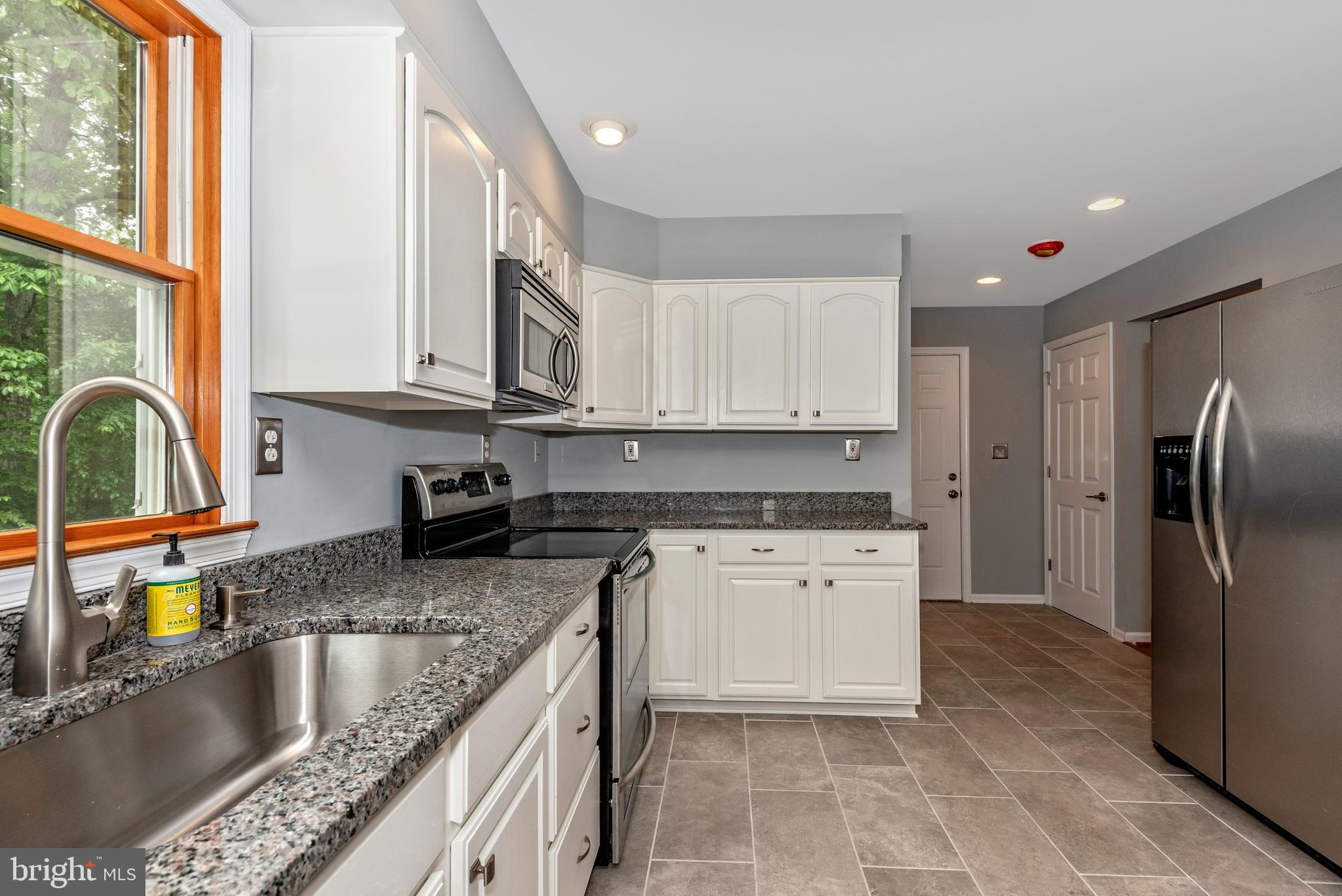 6803 Plantation Road Frederick, MD 21701 - Photo 15 of 38 Gourmet Kitchen w/ SS Appliances & Granite Counter