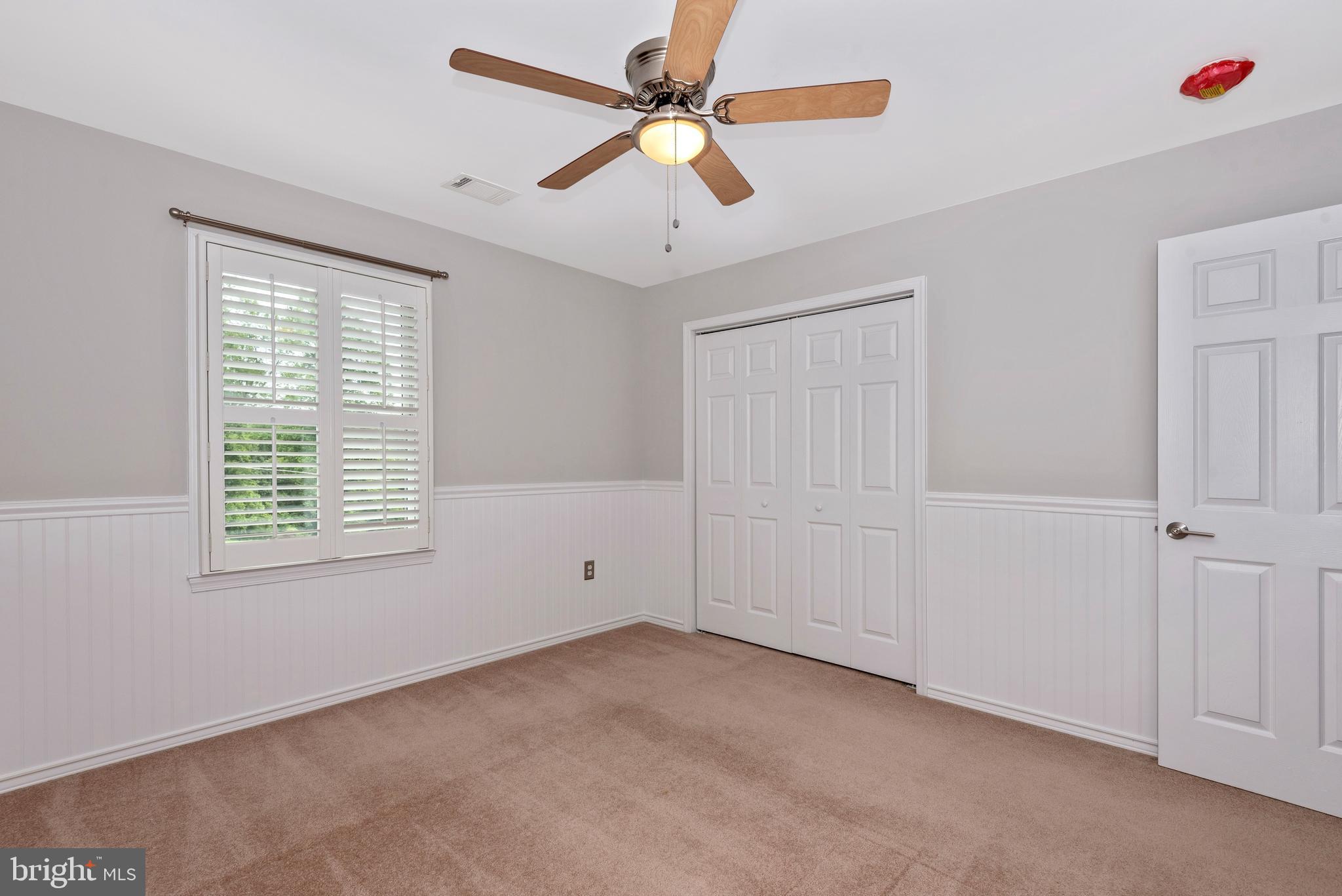 6803 Plantation Road Frederick, MD 21701 - Photo 25 of 38 Bedroom 3 w/ Wainscoting & Ceiling Fan