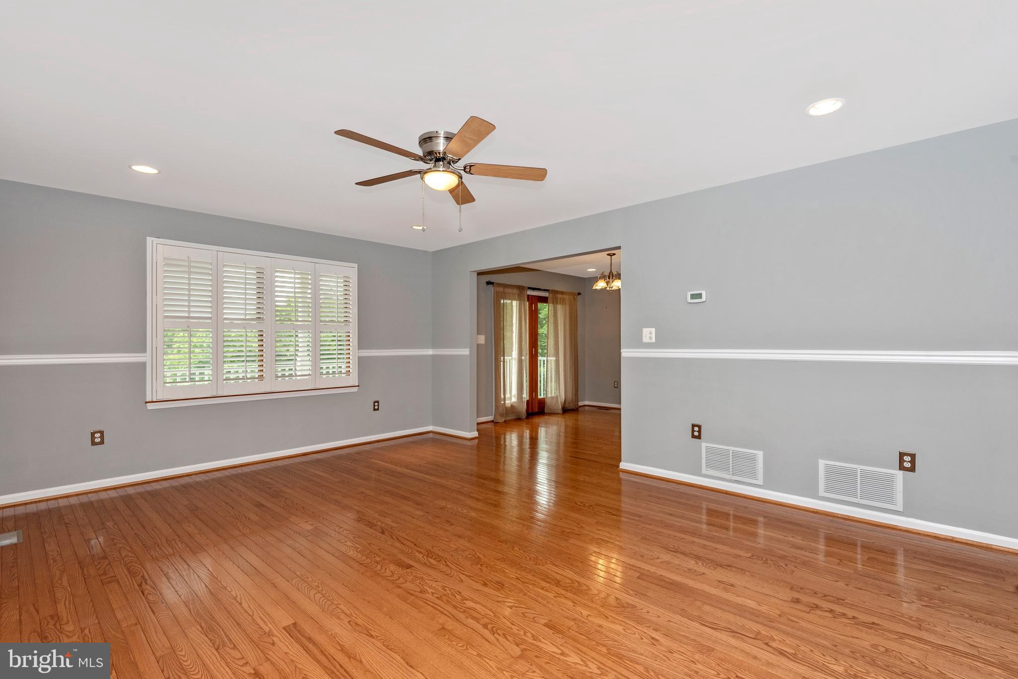 6803 Plantation Road Frederick, MD 21701 - Photo 6 of 38 Bright Living Room w/ Plantation Shutters