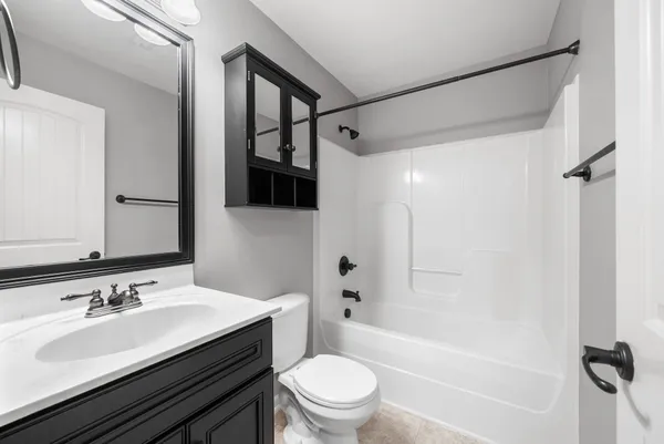 a view of a house with a yard and deck