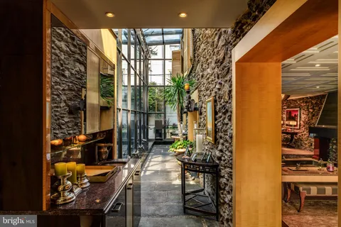 a backyard of a house with table and chairs