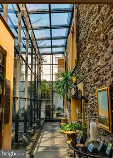 a view of a chairs and table in a patio