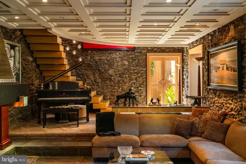 a bedroom with bed or couch and a flat screen tv