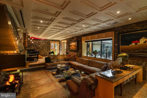 a bedroom with furniture and a fireplace