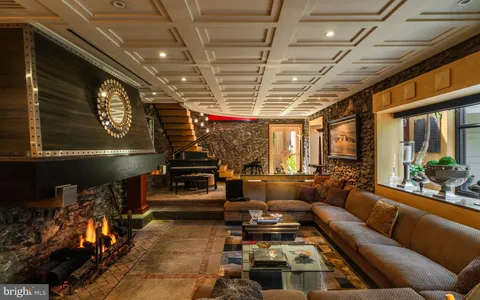 a bathroom with a tub a sink and mirror