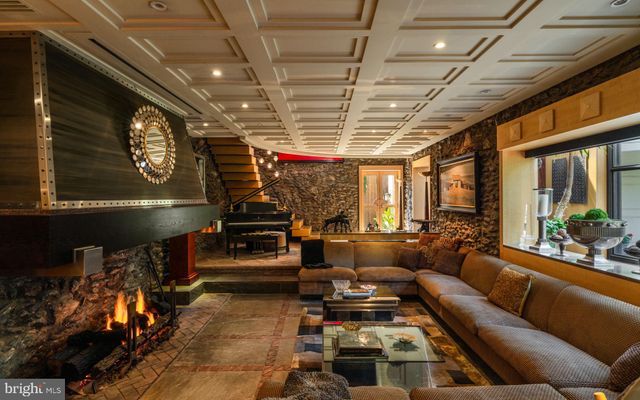a bathroom with a tub a sink and mirror