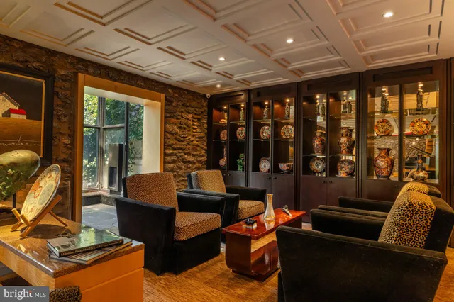 a view of a room with furniture and windows