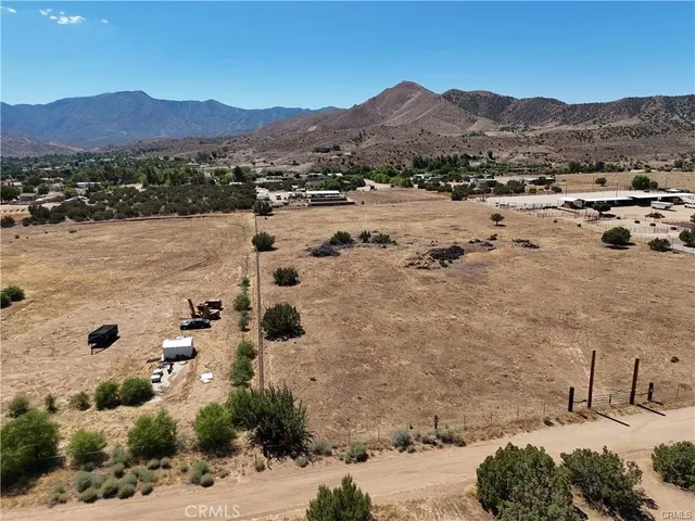 a view of a town with mountains in the background