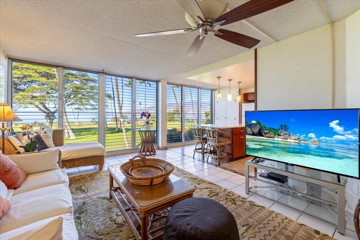 1002 South Kihei Road, Unit 212 Kihei, HI 96753 - Photo 15 of 50 a living room with furniture and a floor to ceiling window