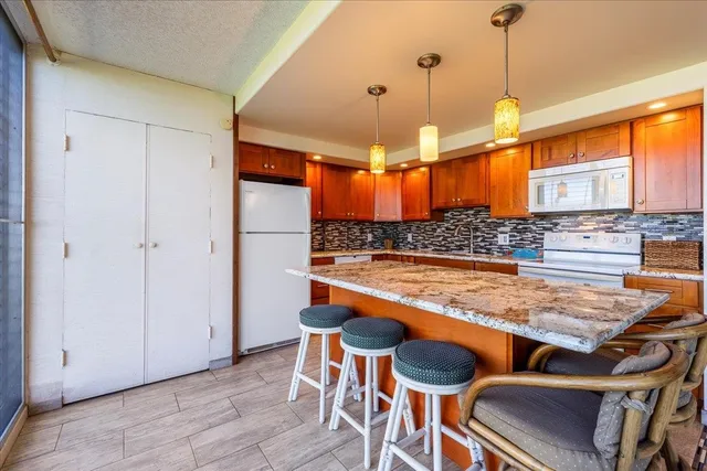 a room with table chairs and entryway