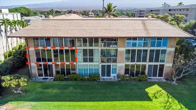 a view of an house with backyard space and garden