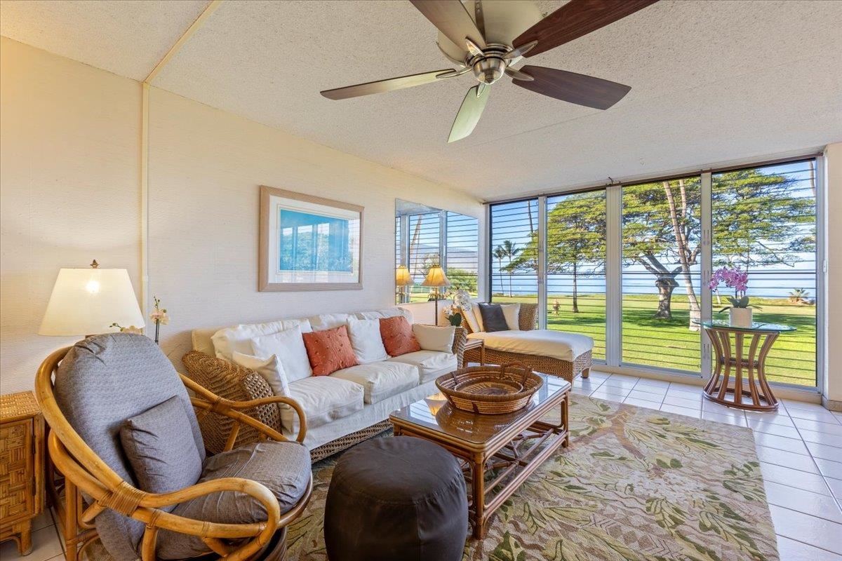 1002 South Kihei Road, Unit 212 Kihei, HI 96753 - Photo 37 of 50 a living room with furniture and a floor to ceiling window