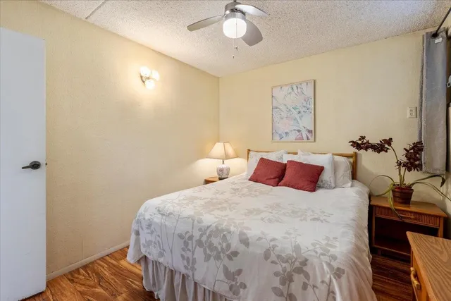 a view of a hallway with a door and stairs