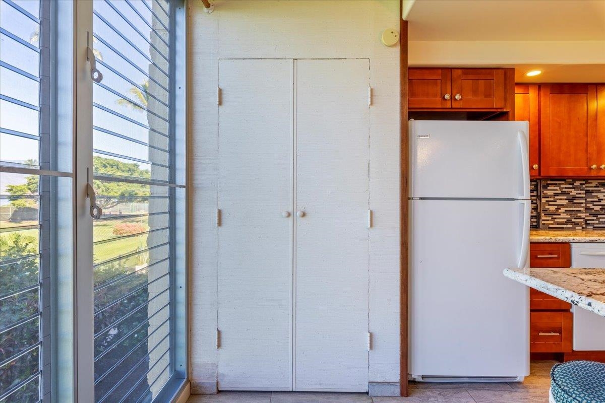 1002 South Kihei Road, Unit 212 Kihei, HI 96753 - Photo 43 of 50 a view of a hallway with a door and stairs