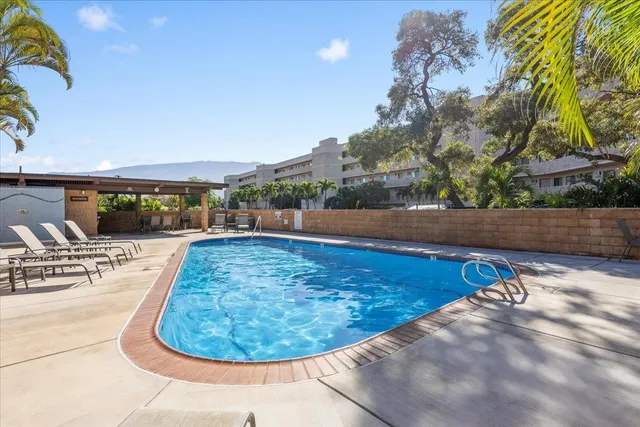 a view of swimming pool with outdoor seating