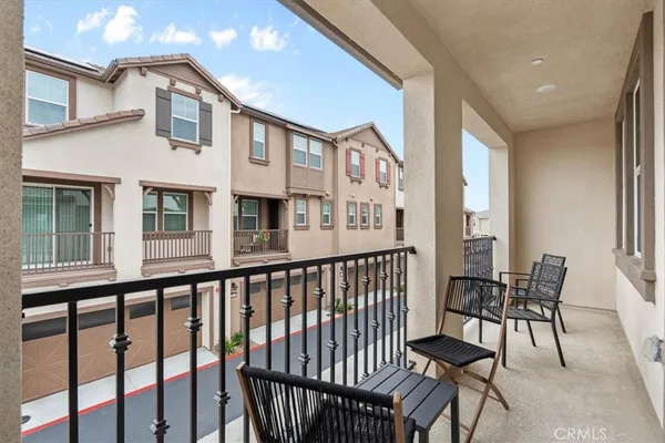 a view of a balcony with chairs