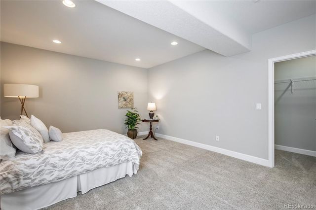 a bedroom with a bed and a lamp