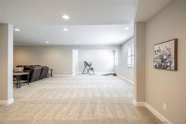 a view of a livingroom with furniture and a flat screen tv