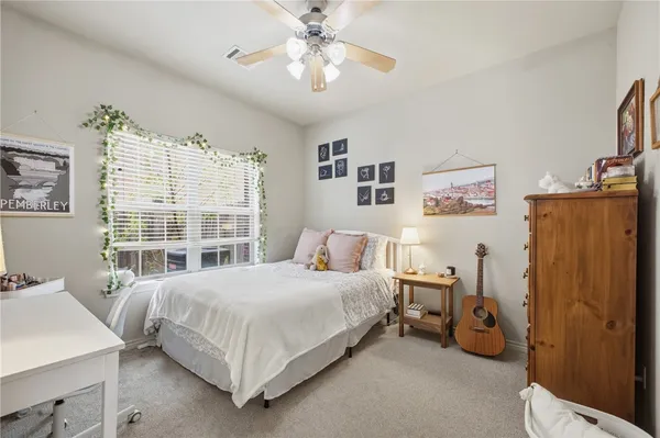 a bedroom with a bed and a table