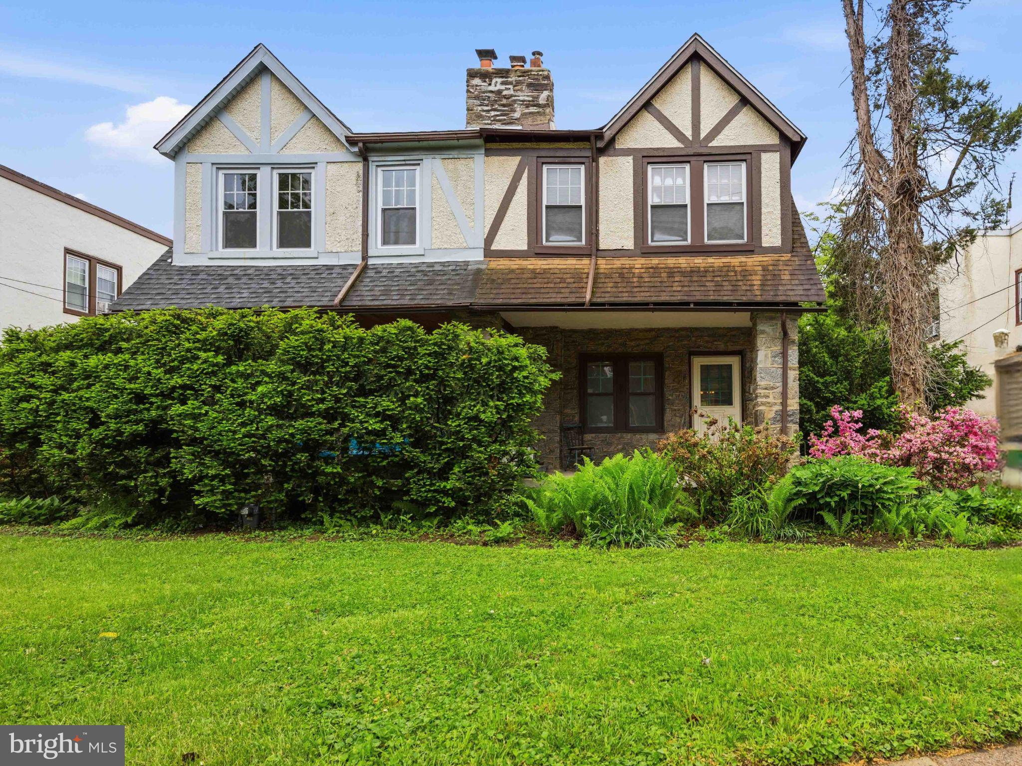 378 Church Road Elkins Park, PA 19027 - Photo 2 of 29 Charming Tudor-style home with lush greenery.