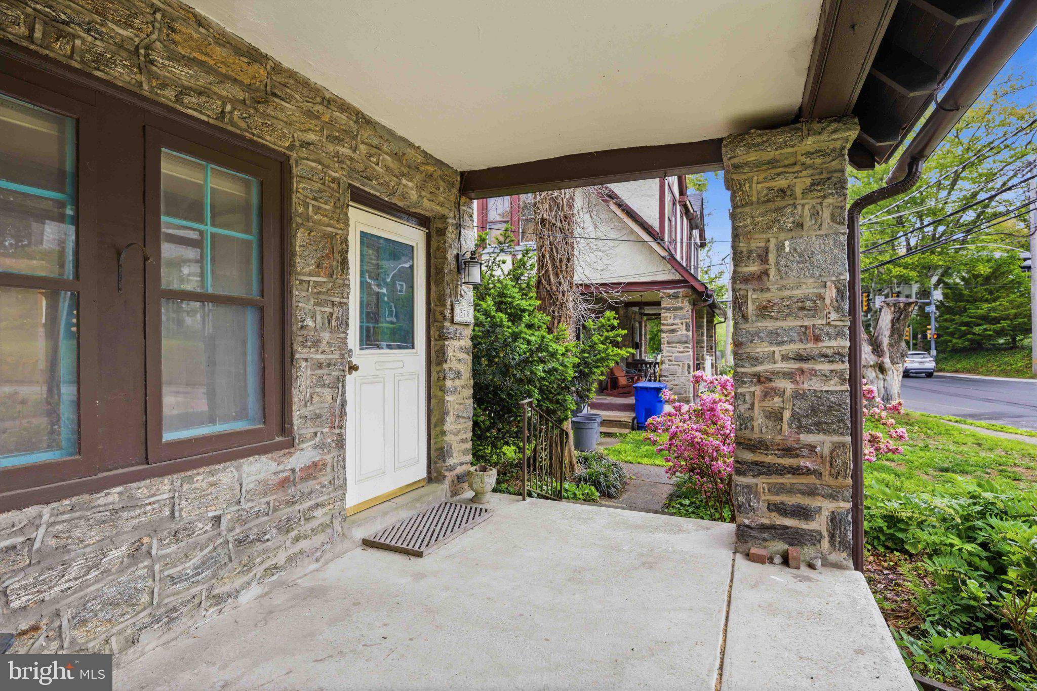 378 Church Road Elkins Park, PA 19027 - Photo 6 of 29 Charming stone porch with lush greenery.