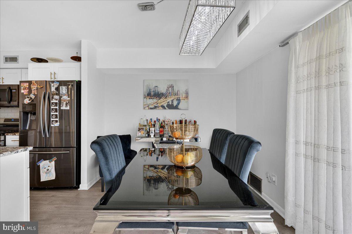 8930 Krewstown Road, Unit 310 Philadelphia, PA 19115 - Photo 5 of 32 a dining room with furniture