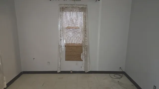 a view of hallway with a window