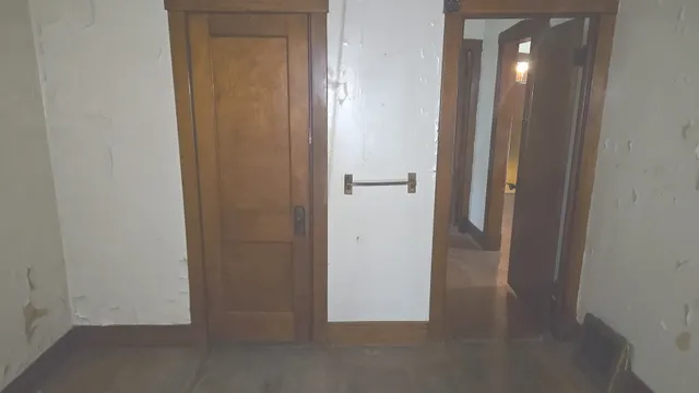 a view of a hallway with closet area