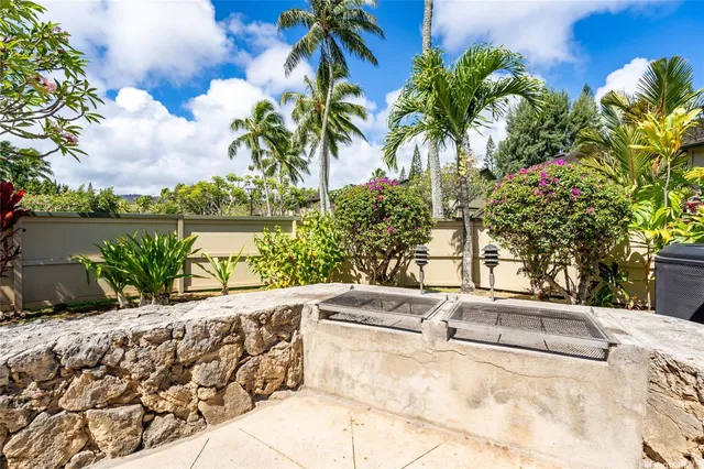 a view of swimming pool with outdoor seating and plants