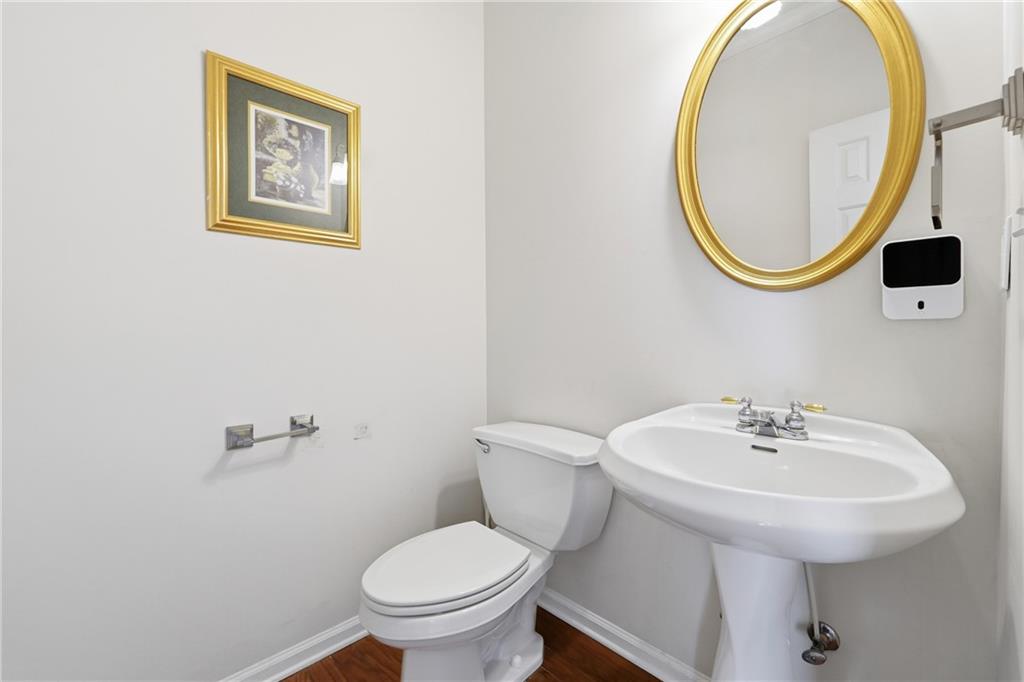 1402 Edgeley Way Lawrenceville, GA 30044 - Photo 13 of 23 a bathroom with a toilet and a sink