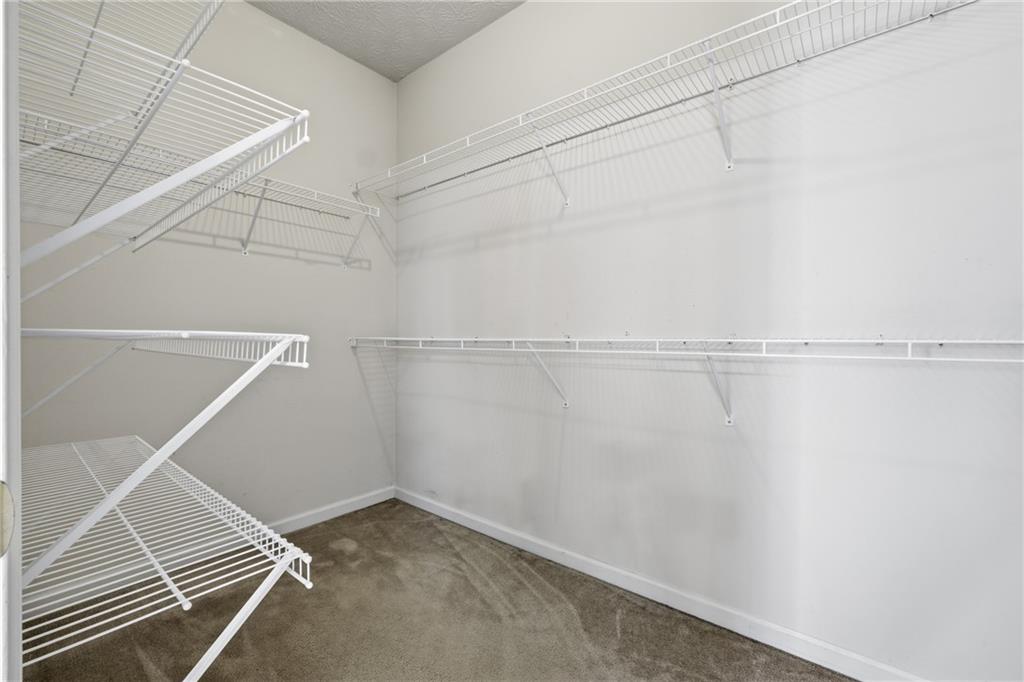 1402 Edgeley Way Lawrenceville, GA 30044 - Photo 18 of 23 a view of a room with racks on the wall