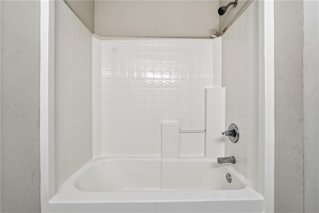 1402 Edgeley Way Lawrenceville, GA 30044 - Photo 22 of 23 a close up of a bathtub curtain