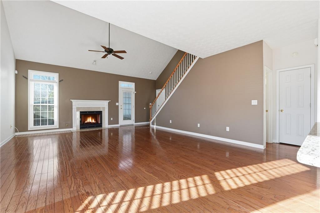 1402 Edgeley Way Lawrenceville, GA 30044 - Photo 5 of 23 a view of empty room with wooden floor and fan
