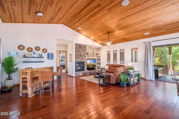 a living room with furniture and wooden floors